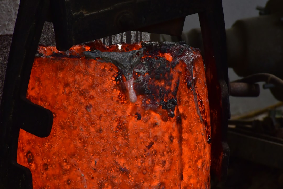 a metal object with a red substance on it