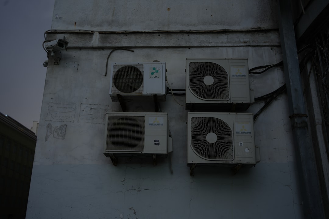 A group of speakers mounted to the side of a building