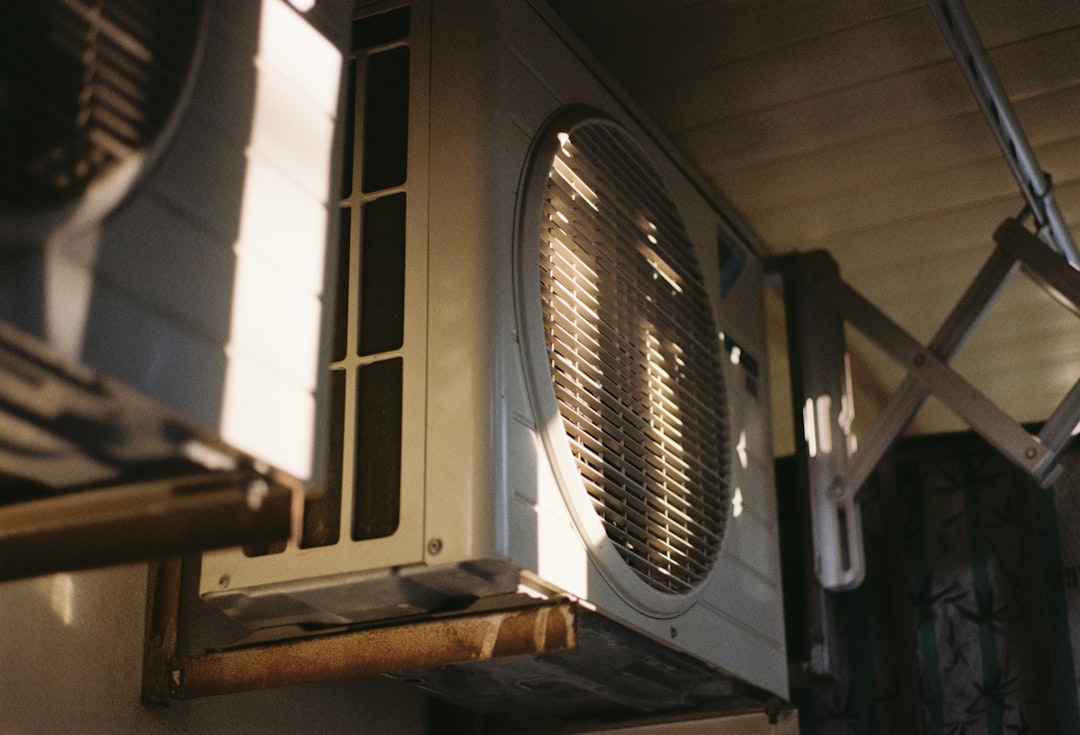 Close-up of an air conditioning unit on a sunny day.