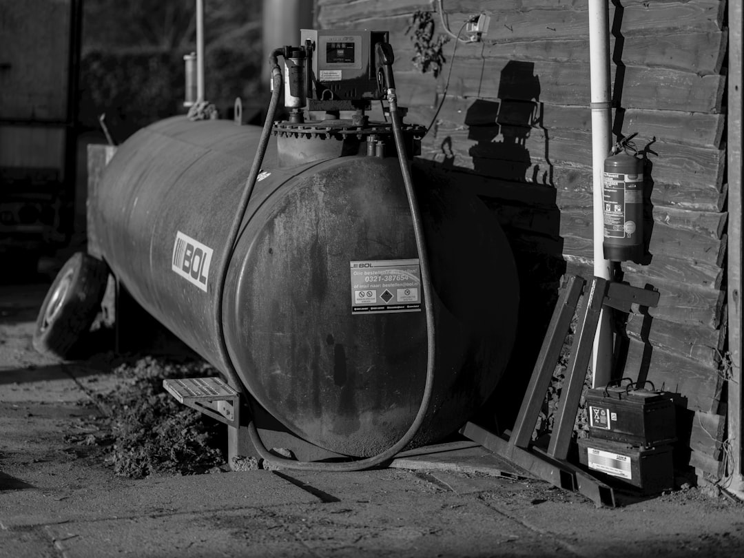 A black and white photo of a propane tank