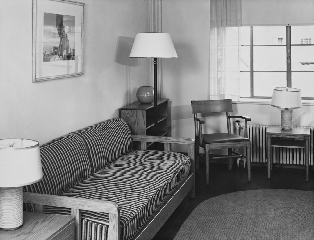 A striped sofa and chair in a room.