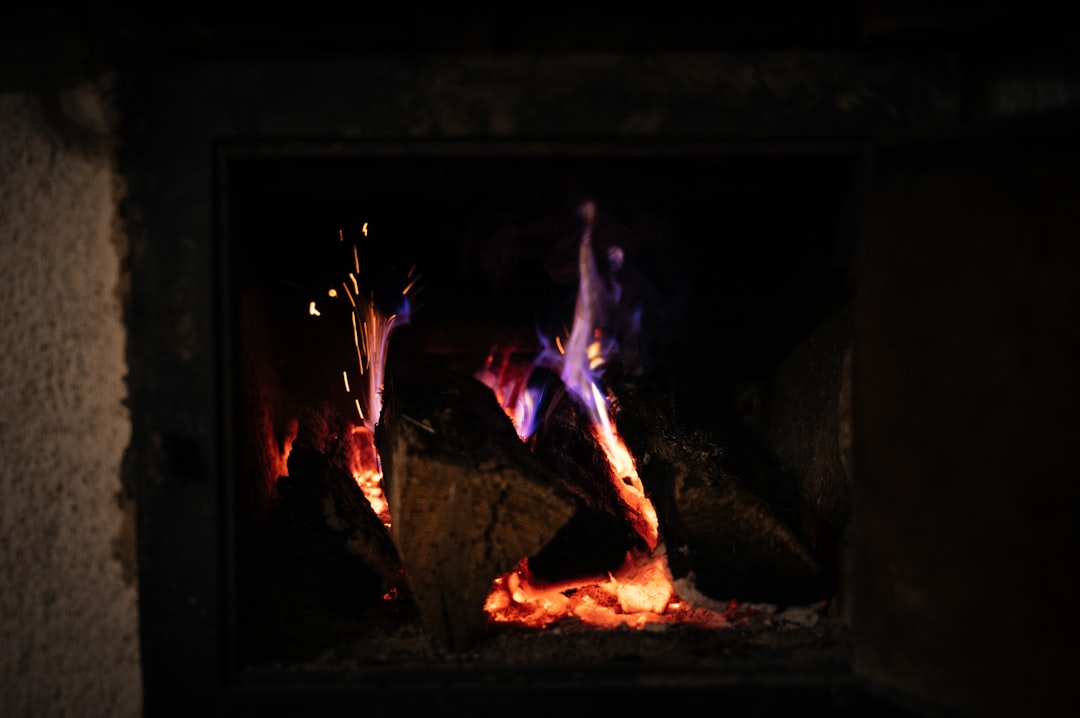 a fire burning in a fireplace with bright flames