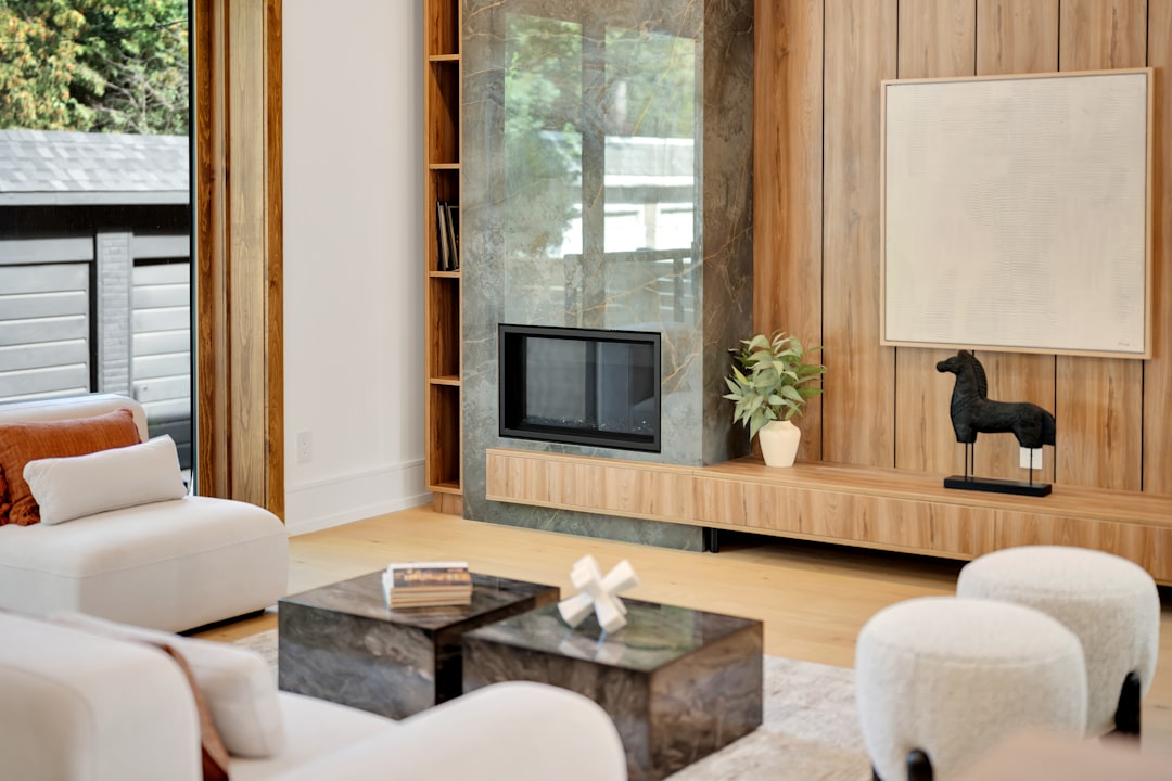 Modern living room with fireplace and minimalist decor.