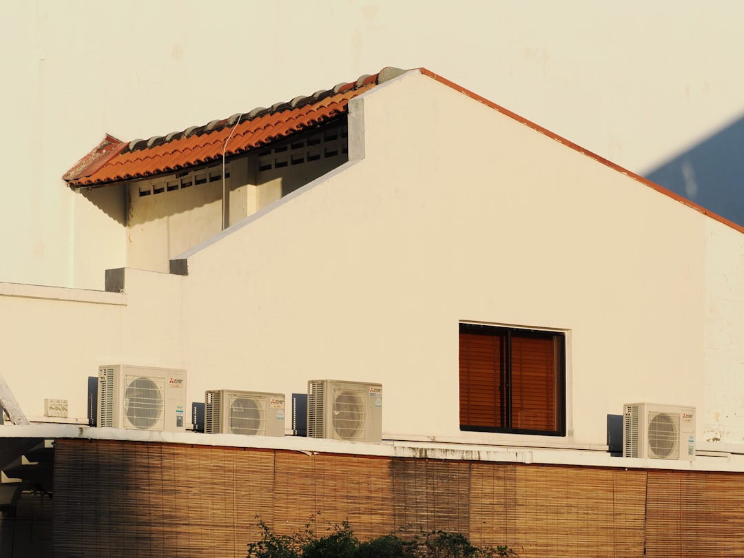 White building with air conditioning units on rooftop